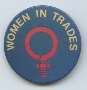 This button highlights the fight to open doors for women to enter non-traditional jobs such as the trades. It was one element of affirmative action campaigns led by union.