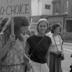 This photo of Beth McAuley and others is from an 1983 abortion rights rally organized in support of Dr. Henry Morgentaler and legalizing free-standing abortion clinics. It was held outside Dr. Morgentaler's clinic on Harbord Street in Toronto.