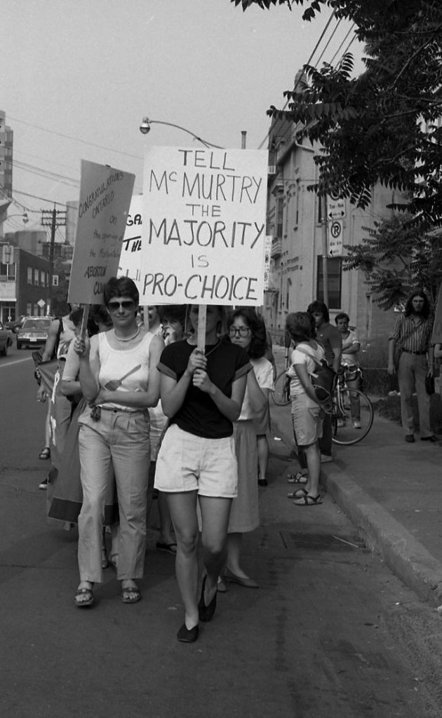 This 1983 pro-choice rally was one of many held outside Dr. Henry Morgentaler's clininc in Toronto. It was organized in support of Dr. Morgentaler and legalizing free-standing abortion clinics.