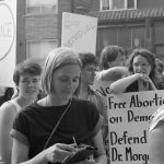 Anne McClard is featured in this photo taken at a 1983 abortion rights rally outside Dr. Henry Morgentaler's clinic in Toronto. The rally was organized in support of Dr. Morgentaler and legalizing free-standing abortion clinics.