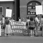 Protesters at rally outside Morgentaler Clinic in Toronto hold banner calling for the legalization of abortion clinics.