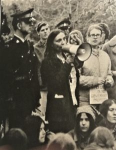 Marcy Cohen uses a megaphone to negotiate with the RCMP as protestors occupied the lawn outside Prime Minister Trudeau's residence. Judy Darcy is in front of her. The demonstrators marched to 24 Sussex after the earlier May 9th march for abortion rights and in response to the Prime Minister, Minister of Justice, and Minister of Health's refusal to meet with organizers.