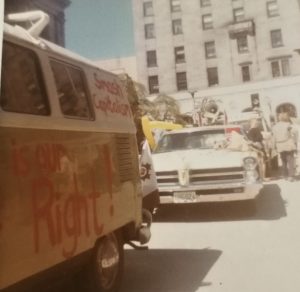 Supporters gather in Vancouver as the Abortion Caravan heads off for Ottawa towards the end of April 1970. The Caravan vehicles with slogans painted along the sides are, front to back, Cathy Walker’s Volkswagen van, Betsy Wood’s (Meadley) convertible, and Charlotte Bedard’s truck.