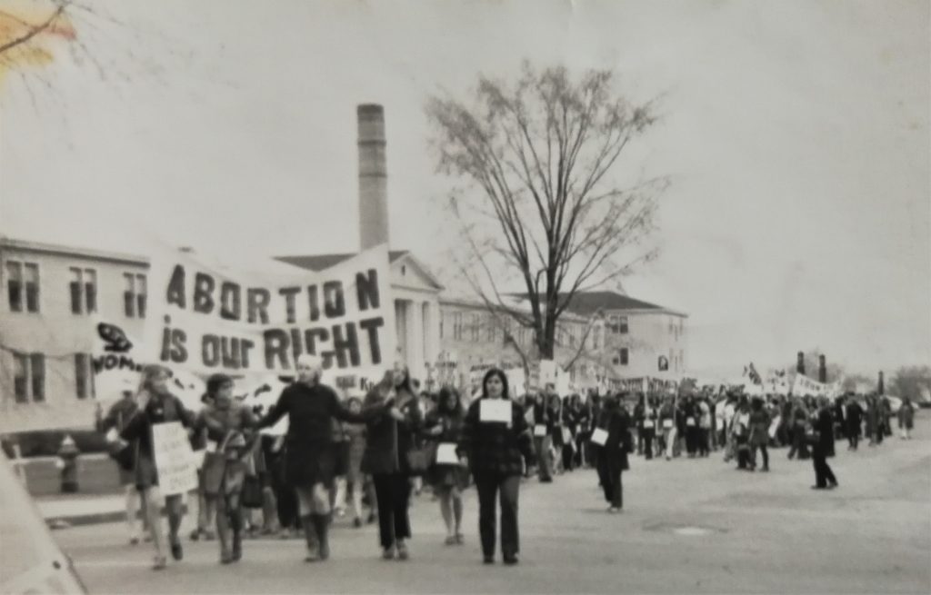 The sign "Abortion is Our Right" is prominent in this photo showing a long stretch of the May 9th Ottawa march organized to coincide with the arrival of the Abortion Caravan as it completed its cross-country trip to raise awareness of the issue.