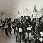 This is a view of the Abortion Caravan demonstration organized in Ottawa as the Caravan arrived from Vancouver. Marchers are wearing a sign around their waists saying, "This Uterus is Not Government Property".