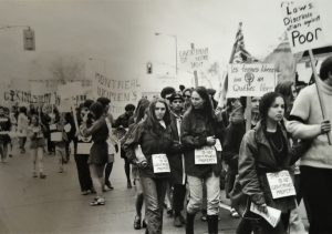 This is a view of the Abortion Caravan demonstration organized in Ottawa as the Caravan arrived from Vancouver. Marchers are wearing a sign around their waists saying, "This Uterus is Not Government Property".