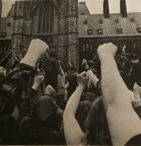 Women stand with fists raised in at a demonstration outside the Parliament Buildings on May 11, 1970, as protesters in the House of Commons galleries disrupt the sitting.