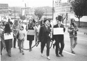 The May 8th Vancouver Demonstration took place in solidarity with the Abortion Caravan and the protests in Ottawa. Anne Roberts and Jean Rands, dressed in men's suits, represent John Munro, Federal Minister of Health, and Ralph Loffmark, B.C. Minister of Health.