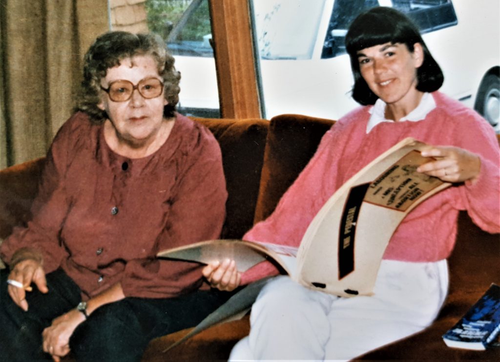 Dodie Weppler, an original member of the Abortion Caravan, looks at Caravan scrapbook created by Marge Hollibaugh. Marge did not travel with the Caravan but joined them in Ottawa.