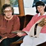 Dodie Weppler, an original member of the Abortion Caravan, looks at Caravan scrapbook created by Marge Hollibaugh. Marge did not travel with the Caravan but joined them in Ottawa.