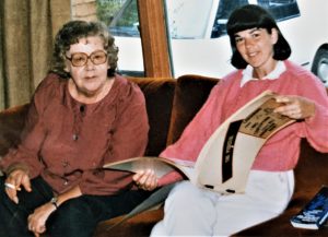 Dodie Weppler, an original member of the Abortion Caravan, looks at Caravan scrapbook created by Marge Hollibaugh. Marge did not travel with the Caravan but joined them in Ottawa.