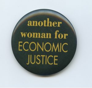 A generic button for women that declares her support for economic justice.