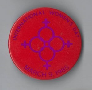 This is a button for International Women's Day in 1985.