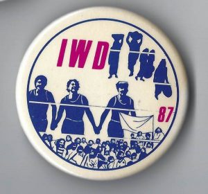 This is a button for International Women's Day in 1987.