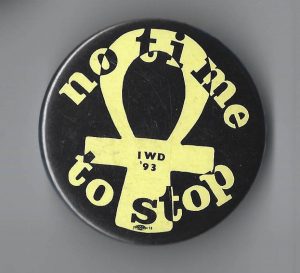 "No Time to Stop" is featured on this button for International Women's Day 1993.