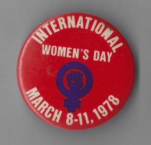 This is a button produced for the Toronto International Women's Day march and celebrations in 1978.