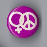 This button features intertwined symbols for Woman and Peace.