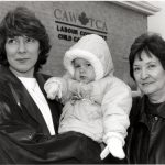 The photo was taken outside the CAW labour community childcare centre in Windsor. The Centre was opened in 1989 after the Canadian Auto Workers bargained with Chrysler, General Motors, and Ford for financial support for childcare centres. The intention was to provide quality, not-for-profit care to support parents and to act as a model for a genuine child care strategy.