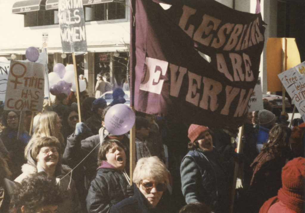 Banner proclaiming that"Lesbians are Everywhere" at Toronto International Women's Day March.