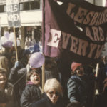 Banner proclaiming that"Lesbians are Everywhere" at Toronto International Women's Day March.