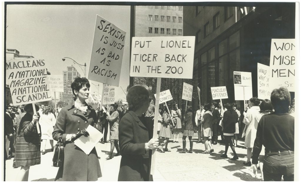 This is one of several photos taken at a 1969 protest organized outside the offices of Maclean's magazine after it published a review of Lionel Tiger's book Men in Groups in which he theorizes about differences in male and female roles and male superiority.