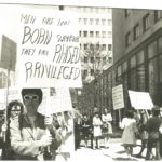 This is one of several photos taken at a protest organized by the New Feminists on May 1 1969 outside the Maclean's magazine office after it published a review of Lionel Tiger's book Men in Groups in which he theorizes about differences in male and female roles and male superiority.