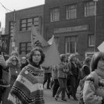 Members of The Women's Press join the "Refuse the Cruise" demonstration in Toronto in October 1983. The photo shows Lois Pike in the foreground; Margie Wolfe behind her; Daphne Read carrying banner and Carolyn Wood beside her.