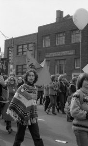 Members of The Women's Press join the "Refuse the Cruise" demonstration in Toronto in October 1983. The photo shows Lois Pike in the foreground; Margie Wolfe behind her; Daphne Read carrying banner and Carolyn Wood beside her.