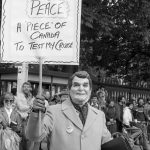 The October 22, 1983 “Refuse the Cruise” protest in Toronto was co-sponsored by the Toronto Disarmament Network (TDN) and the Against Cruise Testing Coalition (ACT). The International Women’s Day Committee was one of many groups to support the march. Sheryl Pollock, a member of IWDC, can be seen to the left and behind “Reagan”.