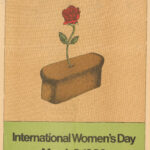 The poster presents a rose rising from a loaf of bread, with the words “International Women’s Day” and underneath the date “March 8th, 1980”.