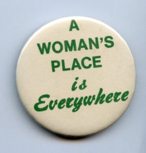 Button with slogan "A Woman's Place is Everywhere"