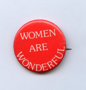 Whimsical button donated by Cathy Mulroy, an activist involved in winning access to jobs at INCO for women.