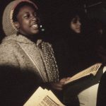 Debbie Douglas, member of the Black Women's Collective, is seen at the protest against police violence. In response to the October 27, 1989, police shooting of 23-year-old Black woman Sophia Cook, the Black Women’s Collective organized the Women’s Coalition Against Racism and Police Violence. This coalition of 35 women’s and progressive organizations brought people together on December 16, 1989, to demand police accountability and an end to police brutality against Black people.