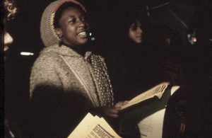 Debbie Douglas, member of the Black Women's Collective, is seen at the protest against police violence. In response to the October 27, 1989, police shooting of 23-year-old Black woman Sophia Cook, the Black Women’s Collective organized the Women’s Coalition Against Racism and Police Violence. This coalition of 35 women’s and progressive organizations brought people together on December 16, 1989, to demand police accountability and an end to police brutality against Black people.