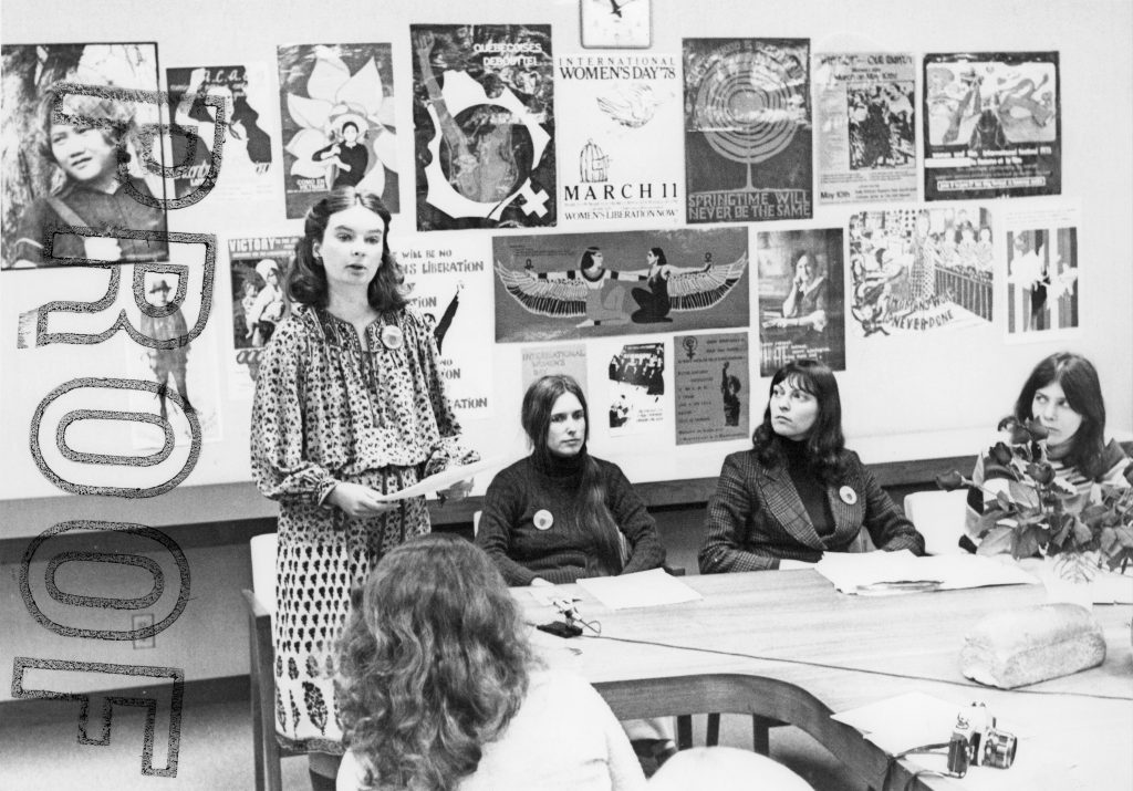 Shelley Acheson, Ontario Federation of Labour Human Rights Director, speaks at an International Women's Day press conference in March 1978. Carolyn Egan is seated to Shelley's left.