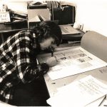 Cathy Carroll, now Billie Carroll, at the Women's Press office working on layout boards. Photo dates between 1972 and 1976. Photograph by Janice Acton.