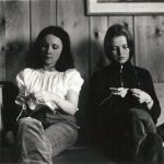 Photo of Genevieve Leslie and Bonnie Ward (now Bonnie Shepherd) knitting while at Women's Press retreat north of Toronto. Photo dates from between 1972 and 1976. Photograph by Janice Acton.