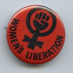 A button with the iconic symbol of the women's liberation movement